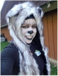 Zoo educator Tara dressed in a gray wolf costume