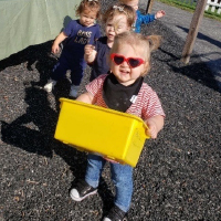 Thumbnail image of children participating in a nature play activity